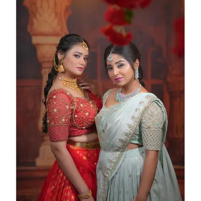 Planning a coordinated look with your bestie or sister? I offer beautiful hand-worked half sarees in complementary colors like this red and mint green, perfect for weddings and festive events.