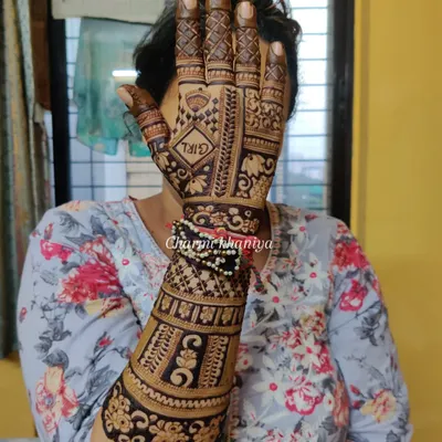 A special mehendi for a mom-to-be! This design for a baby shower (Shrimant) includes a "GIRL" announcement hidden within the beautiful traditional patterns.