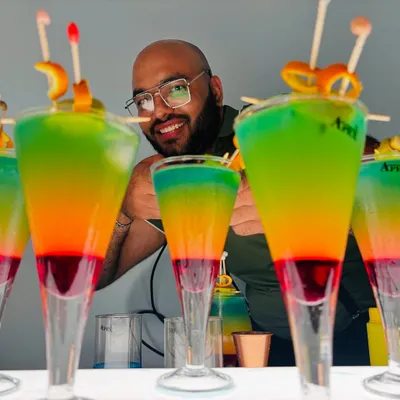 Our 'Rollercoaster' cocktails are a feast for the eyes and the palate. These carefully layered drinks are a crowd favorite at bachelorette parties and mehndi events, showing off our skill in creating visually stunning signature cocktails.