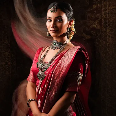 For a contemporary twist on traditional wear, I offer oxidized silver jewellery like this stunning set. It pairs beautifully with this red saree, creating a bold and artistic look for your photoshoot.