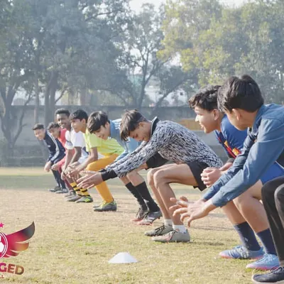 Lined up and ready to go. This is the start of an agility and speed drill, designed to improve our players' reaction time and acceleration on the pitch.