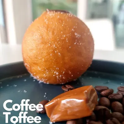 My Coffee Toffee Bomboloni is a treat for coffee lovers. The soft, sugar dusted doughnut is filled with a rich coffee cream, perfectly complementing the sweet toffee flavor.