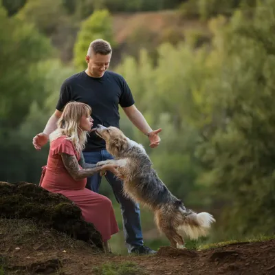 A playful lick from a furry friend during an outdoor maternity shoot. These spontaneous moments of affection are what make photos with pets so special and authentic.