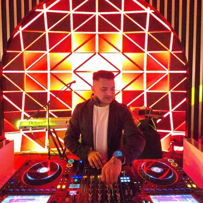 At the console for a sensational 60th birthday party in Dubai. The red geometric backdrop created a vibrant and modern look for the event.