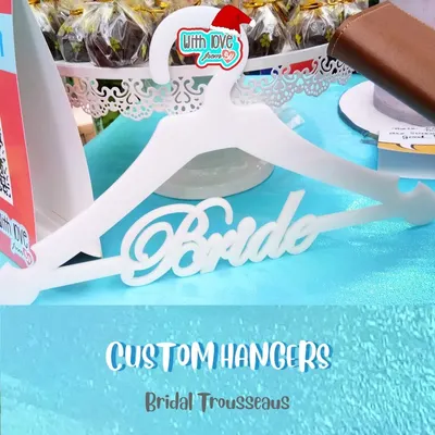 A perfect gift for the bride-to-be! This custom hanger is a beautiful prop for wedding photos and a lovely keepsake for the bridal trousseau. It can be personalized with the future Mrs's name.