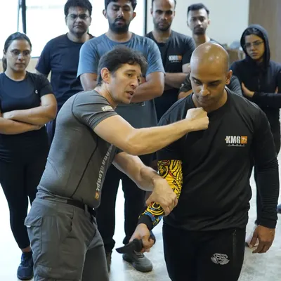 A visiting KMG expert demonstrates a close-quarters knife defense technique. Our seminars give you the chance to learn these critical, life-saving skills directly from some of the world's leading authorities on self-defense.