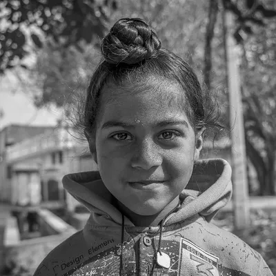A black and white portrait of a young Sikh girl I met in Punjab. Her gentle smile and the soft light make for a simple yet beautiful image that focuses entirely on her personality.