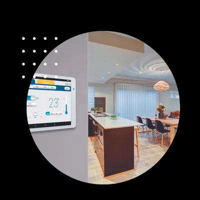 We install wall-mounted touchscreens that provide a centralized view of your home's climate. This panel in a modern kitchen shows the current temperature at 23 degrees Celsius, with easy access to adjust settings for the entire zone.