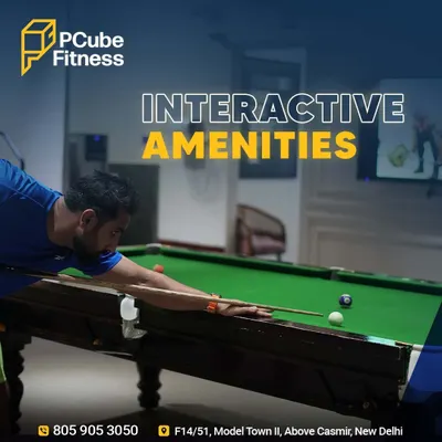 Fitness and fun, all in one place. A member takes a shot at our snooker table, one of the interactive amenities that make our club unique.