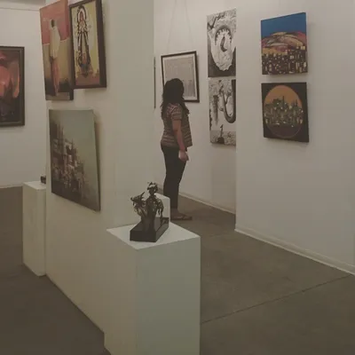 Here is a visitor enjoying the works of some of our excellent Indian contemporary artists. I believe the experience of standing before a piece of art is irreplaceable, and I enjoy seeing people make those personal connections.