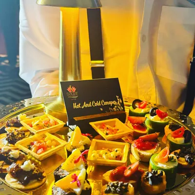 This tray of assorted hot and cold canapés shows the variety I can offer. Each bite is designed to be a burst of flavor, featuring different textures and ingredients to suit every palate.