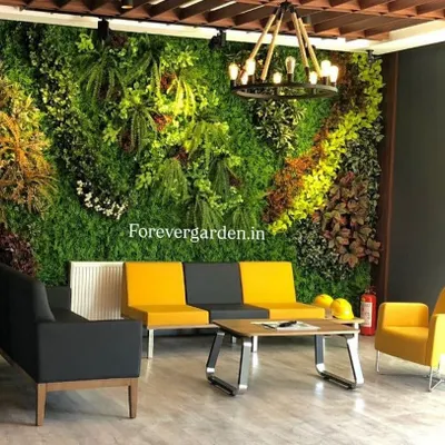A dense and varied artificial green wall serves as a beautiful, modern backdrop in a corporate reception area, requiring zero upkeep.
