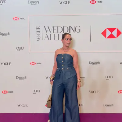 Attending the Vogue Wedding Atelier in a structured denim jumpsuit. This outfit is all about confidence, proving that the right fit and a powerful silhouette can make a statement at any high-profile fashion event.