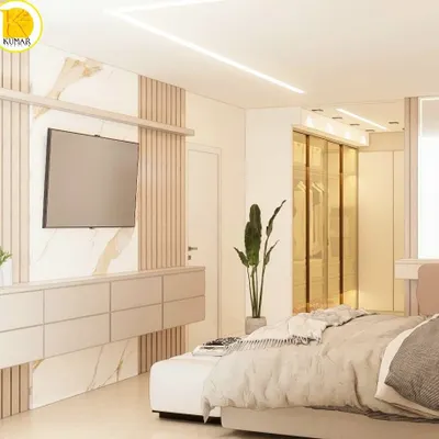 A luxurious master bedroom featuring a stunning combination of marble, wood fluting, and soft neutral tones. The design includes a floating TV console and a seamless connection to a walk-in wardrobe.
