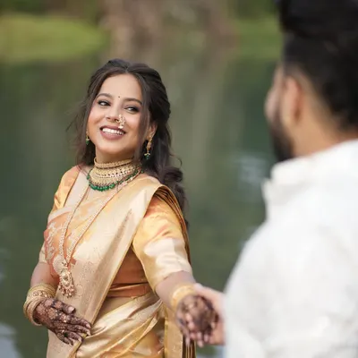 A beautiful client looking radiant at her engagement. I pre-pleated her golden silk saree to ensure it looked absolutely perfect for her entire event and photoshoot.