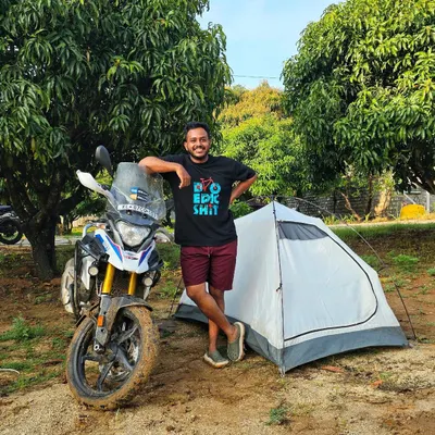 This is the complete adventure lifestyle. A rider, his bike, and his tent, all set up at our campsite after a day of kicking up dust. This is what our weekend training is all about.