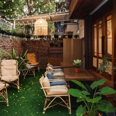 My outdoor seating area is a little oasis, filled with greenery and cozy corners. It's the perfect spot to unwind with a book and a cup of tea.