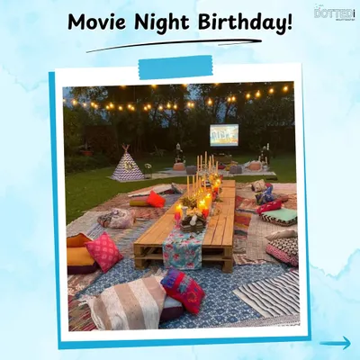 An outdoor movie night birthday setup with a twist of boho picnic style. Guests can relax on colorful rugs and cushions while enjoying a film under the stars.