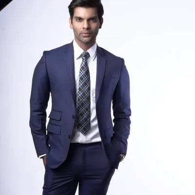 This is the quintessential professional look, a navy pinstripe suit made to measure for a client. The fit is designed to convey confidence, making it ideal for important meetings and corporate environments.