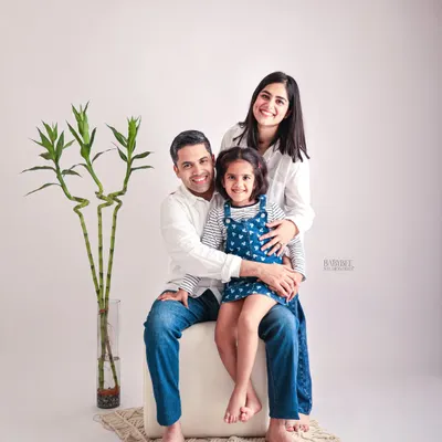 A classic and clean family portrait. We believe in timeless photos that capture the love and connection between parents and their child in a simple, beautiful way.