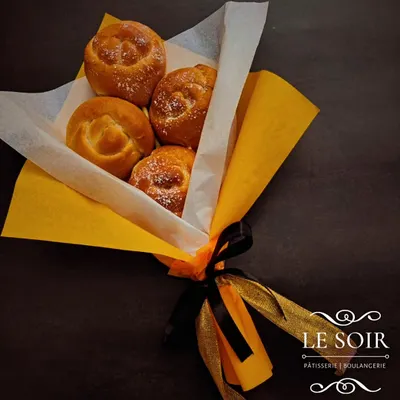 A beautifully wrapped Bread Bouquet, ready for gifting. This is a creative and delicious alternative to traditional flowers, perfect for making someone's day.