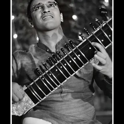Lost in the music during a performance. This black and white photograph captures the moment of complete immersion in the Raag.