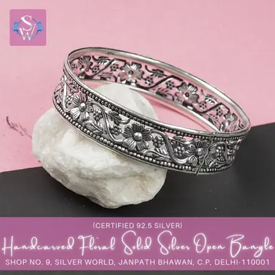 This bestselling hand-carved floral bangle is a masterpiece of craftsmanship. The intricate 'jaali' work and floral motifs make it a stunning piece of ethnic jewelry.