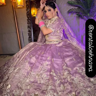 This grand lavender ball-gown lehenga is one of my most requested pieces. It has a massive flare with beautiful silver floral embroidery, perfect for creating a fairytale look for your engagement or pre-wedding shoot.