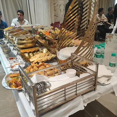 A wide view of one of our extensive buffet spreads for a housewarming party. You can see the variety of dishes, from appetizers to mains, all beautifully presented and ready for guests.