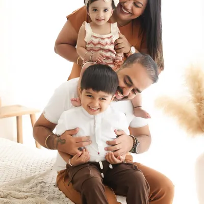 This is the heart of my work. Capturing the joyful, chaotic, and beautiful moments of a family simply being together. This playful pose in our boho-themed setup is a perfect example of the authentic memories we create.