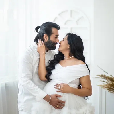 An intimate moment of connection, captured in the pure and simple setting of my all-white studio setup.