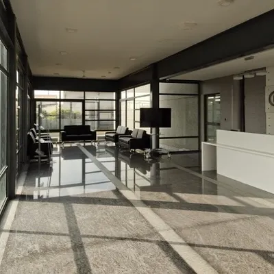 The lobby for Torishima Pumps was designed to be open and filled with light, featuring floor-to-ceiling glass walls and polished granite flooring. The minimalist design and clean lines create a sleek, professional first impression.
