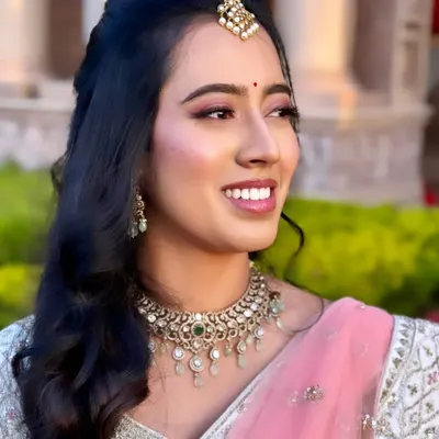 Keerthi looking absolutely radiant for her reception. We went with a soft pink smokey eye and a glossy lip to complement her beautiful smile and pastel lehenga.