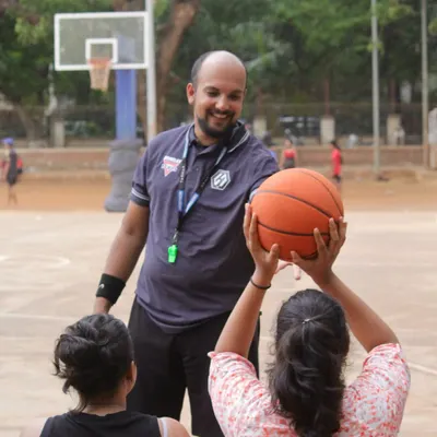 One of our organizers explaining a drill during the Skills Challenge. We're passionate about teaching the game, not just managing it.