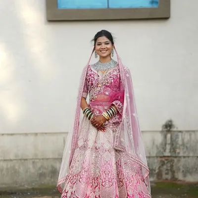 Our bride shines in this beautiful pink and white ombre lehenga. It's a perfect example of our modern bridal collection, ideal for day ceremonies and brides who want a fresh, elegant look.