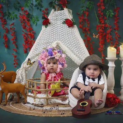 Double the cuteness! This enchanting studio session for twins features a boho teepee, woodland deer, and beautiful floral crowns for a magical, fairytale feel.
