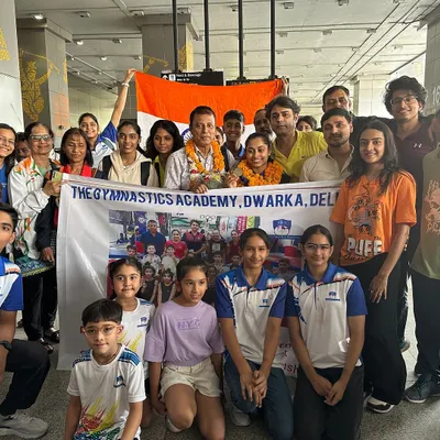 Our entire academy family gathers at the airport to welcome home Padma Shri Olympian Dipa Karmakar, holding our banner with pride.