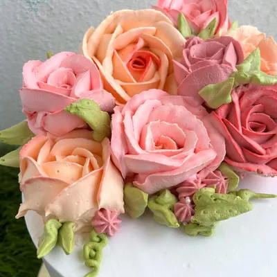 We have a special place in our hearts for whipped cream roses. This close-up shows the delicate, multi-toned petals we pipe by hand to create a realistic and beautiful floral bouquet.