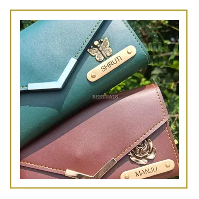 A personalized wallet is a classic gift that's always appreciated. I customized these elegant women's wallets with the names 'Shruti' and 'Manju' and added a unique charm for each, a butterfly and a rose, to match their personalities.
