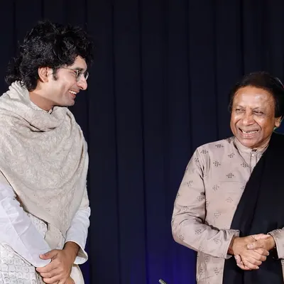 A candid moment of shared joy on stage with the legendary Ustad Shahid Parvez Khan Sahab during a concert in Surat. The unspoken communication between artists is the true magic of live accompaniment.