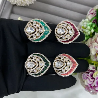 Our leaf-shaped adjustable rings, featuring a large central Moissanite stone surrounded by American Diamonds. These are available in green, red, and pink Meenakari finishes.