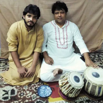 Another cherished photograph with my Guruji. The guru-shishya parampara, or the tradition of learning from a master, is the foundation of Indian classical music and my own journey.