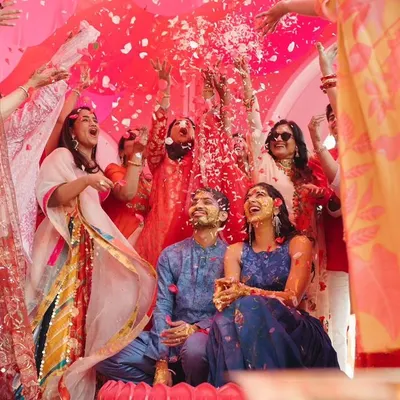 A 'phoolon ki holi' moment during a unique 'Gulabi Haldi' in Jaipur. I love creating unconventional themes that reflect the couple's personality while keeping the spirit of the tradition alive.