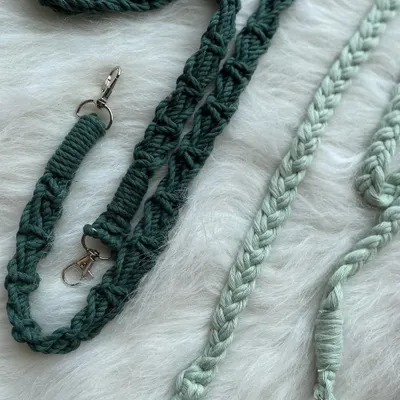 The details matter. Here's a close-up of two different strap styles I create: a complex, textured knot in dark green and a classic, smooth braid in a lighter green.