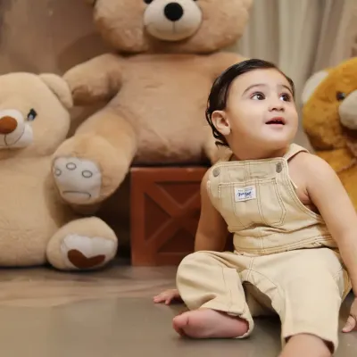 A candid, upward glance from a baby boy during our teddy bear themed shoot. We look for these spontaneous moments that reveal a child's curiosity.