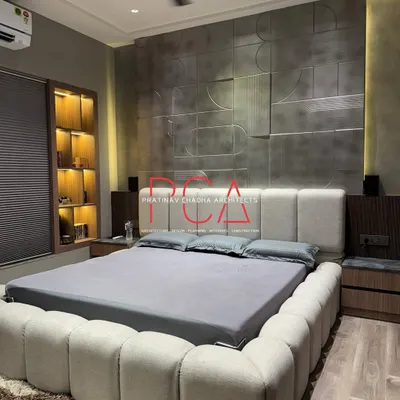 A full view of the son's room, highlighting the interplay between the antique silver-finished wall, the soft bouclé bed, and the warm wood flooring. The design balances bold textures with a calm, neutral color palette for a sophisticated yet comfortable atmosphere.