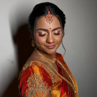 A moment of quiet grace. I used warm, diffused eyeshadows and a soft highlighter to create a gentle, moonlit glow that enhances her features without feeling heavy.