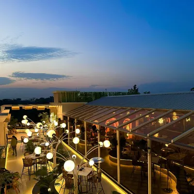 The Tipsy Town rooftop at dusk, a moment when the architectural lighting begins to take over. The design aims to create a future forward space that still feels deeply connected to nature.