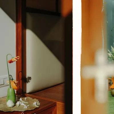 A collage showing quirky housewarming decor, where vegetables and fruits are used in floral arrangements.