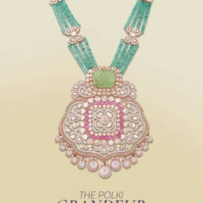 The Polki Grandeur, crafted for moments you’ll cherish. This magnificent pendant necklace combines a large polki centerpiece with emerald beads and delicate pearl drops.